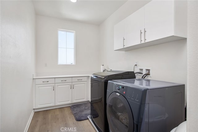 36275 Firelight Cir, Wildomar, CA 92595 - laundry room featuring washer and dryer, cabinet space, and light wood-type flooring