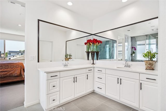 36275 Firelight Cir, Wildomar, CA 92595 - ensuite bathroom with double vanity, tile patterned flooring, and recessed lighting