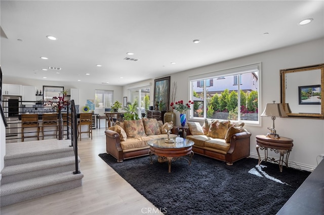 36275 Firelight Cir, Wildomar, CA 92595 - living area featuring light wood-style floors, recessed lighting, and stairway