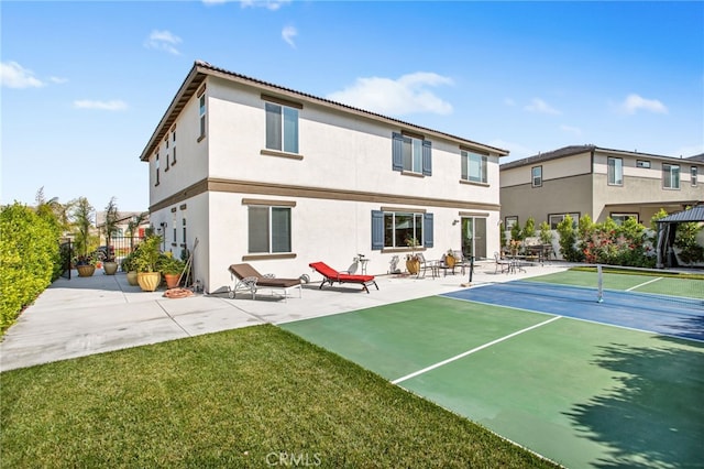 36275 Firelight Cir, Wildomar, CA 92595 - rear view of house with stucco siding, a tennis court, and a patio area