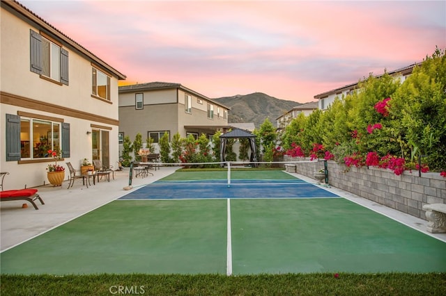 36275 Firelight Cir, Wildomar, CA 92595 - view of tennis court featuring a gazebo, a mountain view, and a patio