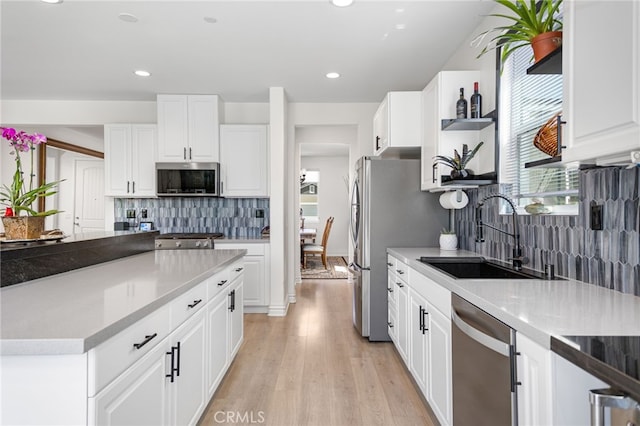 36275 Firelight Cir, Wildomar, CA 92595 - kitchen featuring stainless steel appliances, decorative backsplash, light wood-style flooring, white cabinets, and recessed lighting