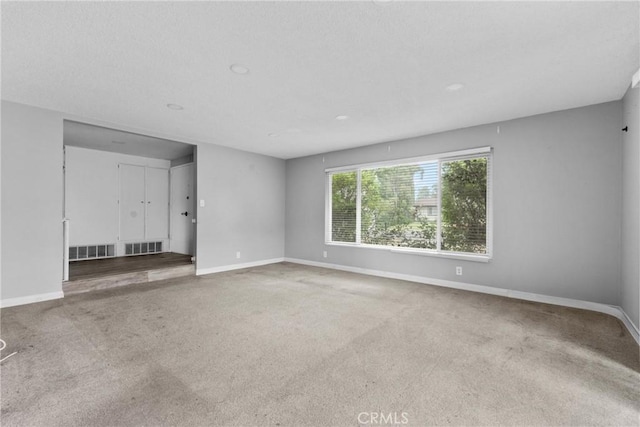 1754 N 1st Ave, Upland, CA 91784 - unfurnished living room featuring baseboards and carpet floors