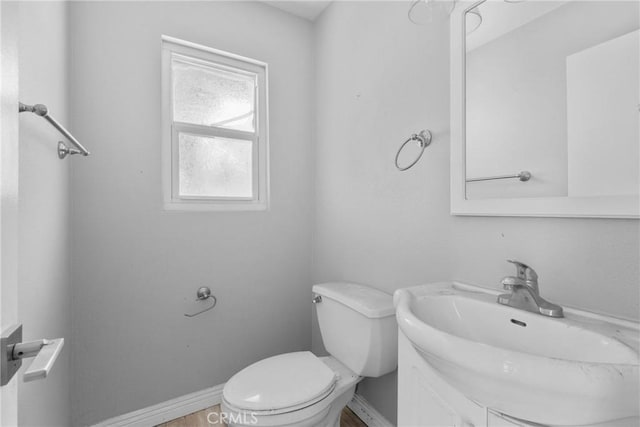 1754 N 1st Ave, Upland, CA 91784 - bathroom featuring toilet, vanity, and baseboards