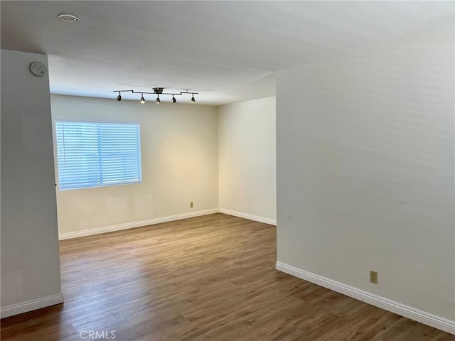 428 N Chapel Ave Unit B, Alhambra, CA 91801 - spare room featuring wood finished floors, baseboards, and a smoke detector