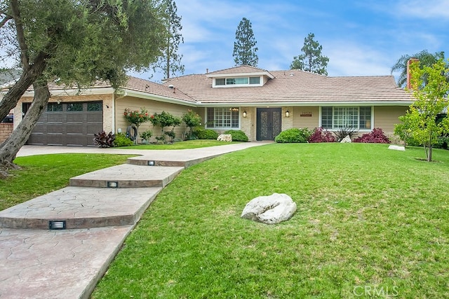 19520 Bermudas St, Porter Ranch, CA 91326 - view of front facade featuring a front yard, a tile roof, and a garage