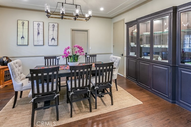 19520 Bermudas St, Porter Ranch, CA 91326 - dining room featuring dark wood-type flooring, a chandelier, ornamental molding, and recessed lighting
