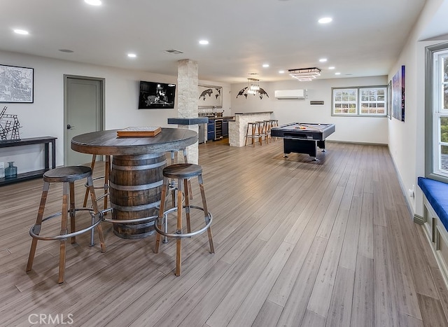 19520 Bermudas St, Porter Ranch, CA 91326 - recreation room featuring light wood-style flooring, an AC wall unit, pool table, recessed lighting, and bar area