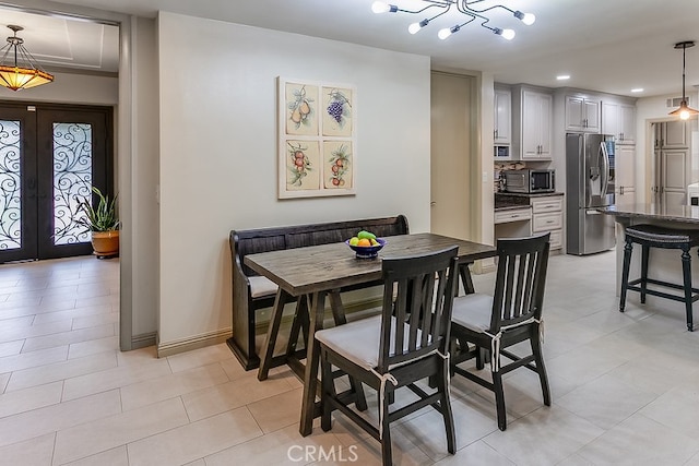 19520 Bermudas St, Porter Ranch, CA 91326 - dining space with french doors, recessed lighting, baseboards, and light tile patterned floors