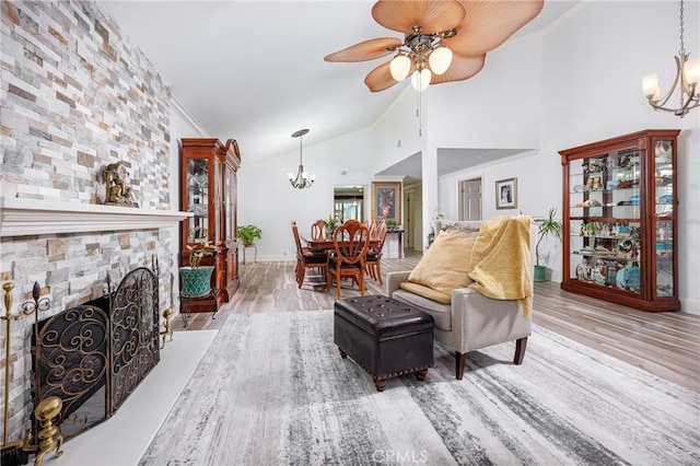 24711 Eloisa Dr, Mission Viejo, CA 92691 - living area with a chandelier, wood finished floors, ceiling fan, baseboards, and high vaulted ceiling