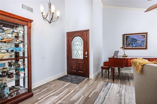 24711 Eloisa Dr, Mission Viejo, CA 92691 - entryway featuring a chandelier, wood finished floors, ornamental molding, and baseboards