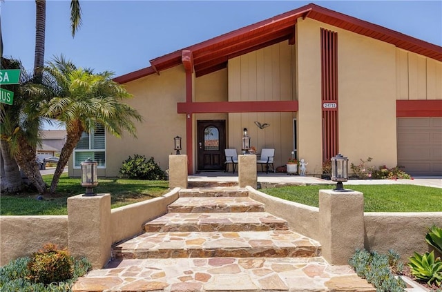 24711 Eloisa Dr, Mission Viejo, CA 92691 - doorway to property with covered porch and an attached garage