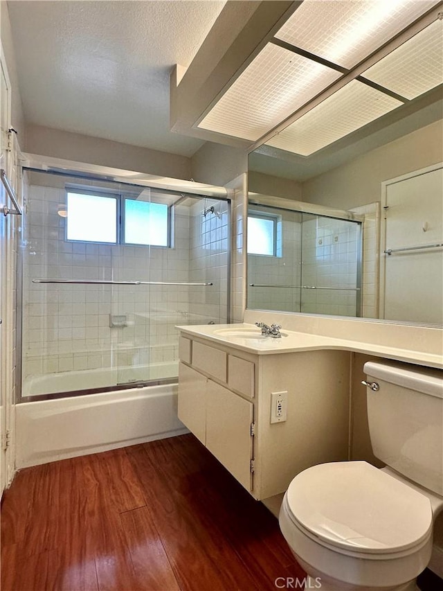 25843 Mcbean Unit 9, Valencia, CA 91355 - bathroom with shower / bath combination with glass door, wood finished floors, toilet, and vanity