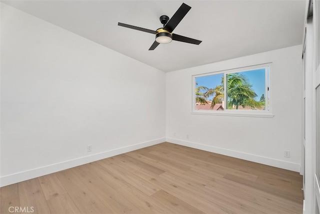 21692 Seaside Ln, Huntington Beach, CA 92646 - spare room featuring baseboards, light wood-type flooring, a ceiling fan, and lofted ceiling