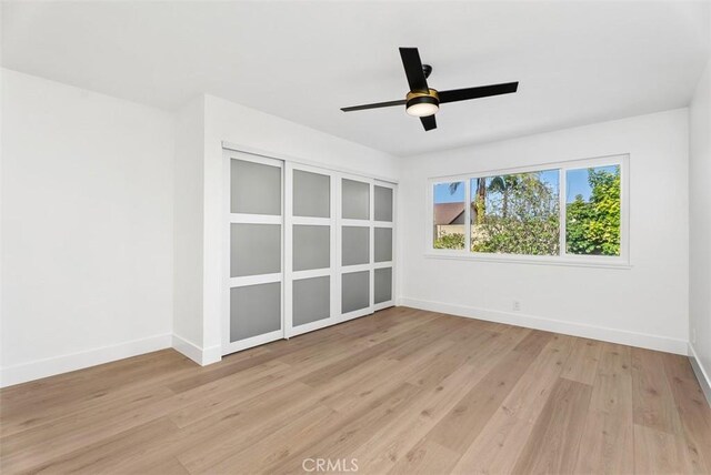 21692 Seaside Ln, Huntington Beach, CA 92646 - spare room with light wood-type flooring, baseboards, and a ceiling fan