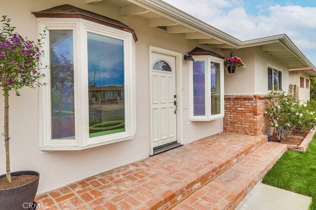 117 E 229th Pl, Carson, CA 90745 - doorway to property with stucco siding and brick siding