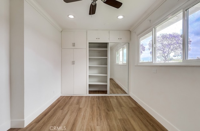 117 E 229th Pl, Carson, CA 90745 - unfurnished bedroom with light wood-type flooring, baseboards, recessed lighting, a closet, and ornamental molding