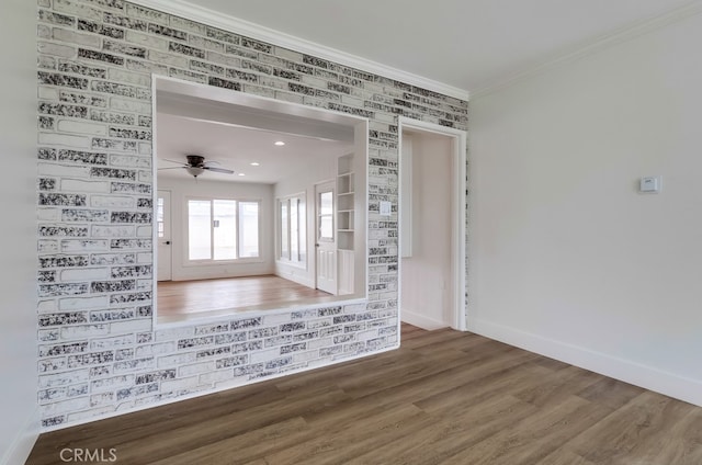 117 E 229th Pl, Carson, CA 90745 - spare room featuring baseboards, wood finished floors, ceiling fan, and ornamental molding