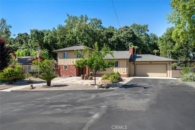 3580 Maricopa Rd, Atascadero, CA 93422 - view of front of property featuring driveway, a garage, a chimney, board and batten siding, and brick siding