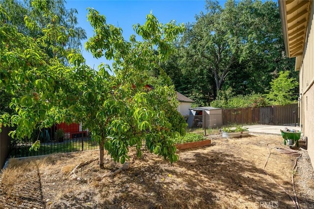 3580 Maricopa Rd, Atascadero, CA 93422 - fenced backyard featuring a storage unit and a garden