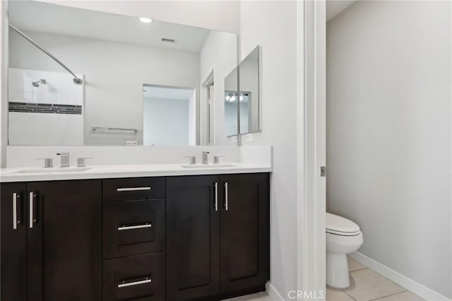 639 Channel Way, Costa Mesa, CA 92627 - bathroom featuring double vanity, tile patterned flooring, and tiled shower