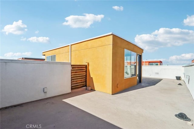 639 Channel Way, Costa Mesa, CA 92627 - view of property exterior featuring a patio and stucco siding
