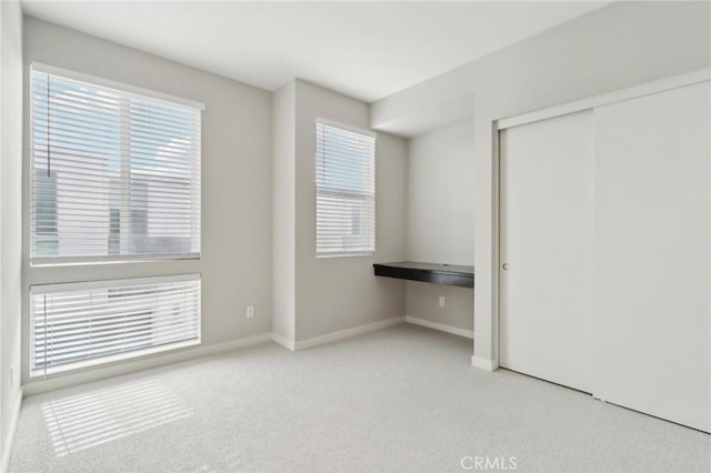 639 Channel Way, Costa Mesa, CA 92627 - unfurnished bedroom with carpet, a closet, and baseboards