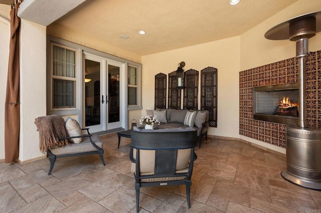 6937 Corte Langosta, Carlsbad, CA 92009 - view of patio with french doors and an outdoor living space with a fireplace