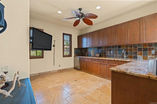 6937 Corte Langosta, Carlsbad, CA 92009 - kitchen featuring tasteful backsplash, ceiling fan, a sink, recessed lighting, and brown cabinetry