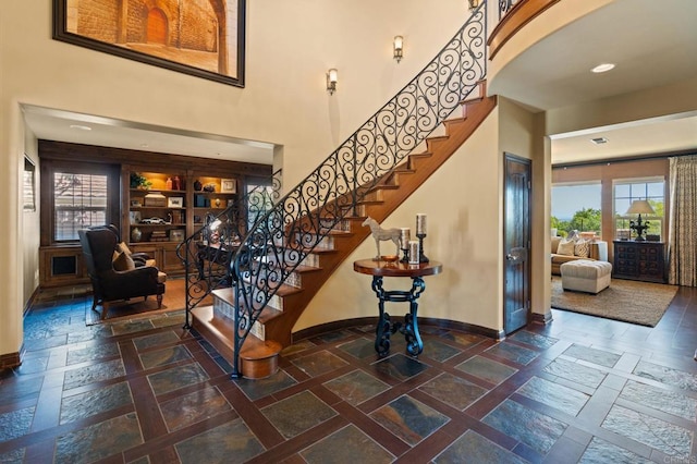 6937 Corte Langosta, Carlsbad, CA 92009 - stairway featuring baseboards, a high ceiling, stone tile flooring, and recessed lighting