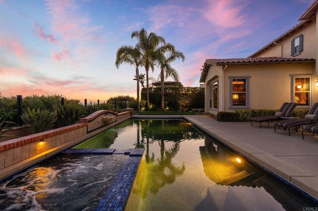 6937 Corte Langosta, Carlsbad, CA 92009 - pool at dusk with a patio area and a pool with connected hot tub