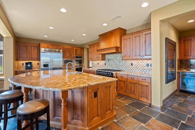6937 Corte Langosta, Carlsbad, CA 92009 - kitchen featuring high quality appliances, recessed lighting, backsplash, a sink, and custom range hood