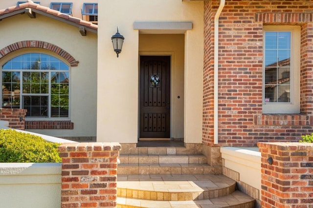 6937 Corte Langosta, Carlsbad, CA 92009 - view of exterior entry with brick siding and stucco siding