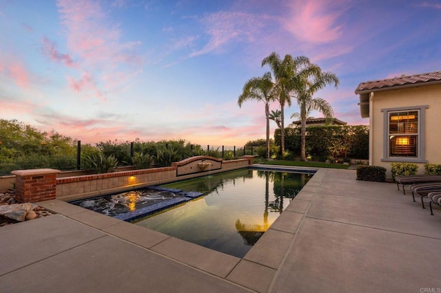 6937 Corte Langosta, Carlsbad, CA 92009 - pool at dusk with a pool with connected hot tub and a patio