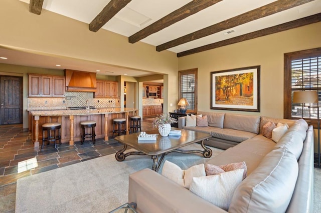 6937 Corte Langosta, Carlsbad, CA 92009 - living area with stone tile floors, beam ceiling, and recessed lighting