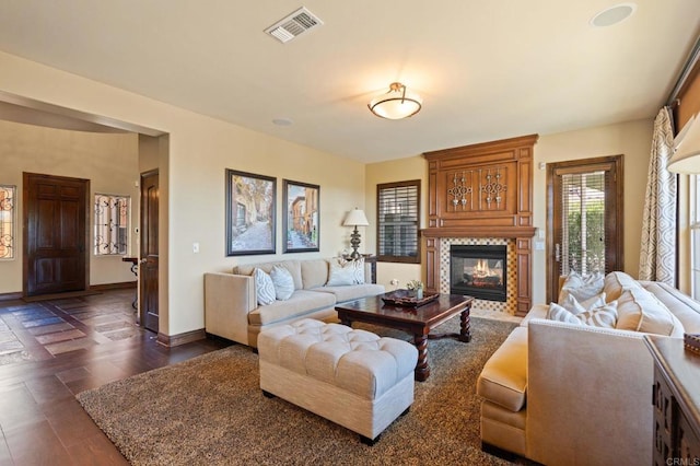 6937 Corte Langosta, Carlsbad, CA 92009 - living area featuring dark wood-style flooring and a fireplace