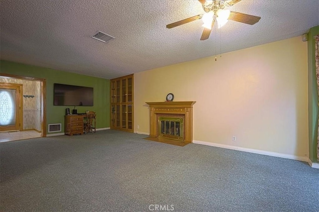 5062 Magnolia Ave, Riverside, CA 92506 - unfurnished living room featuring carpet flooring, a fireplace with flush hearth, a textured ceiling, baseboards, and ceiling fan