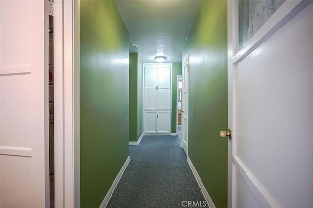 5062 Magnolia Ave, Riverside, CA 92506 - hallway with baseboards and dark carpet