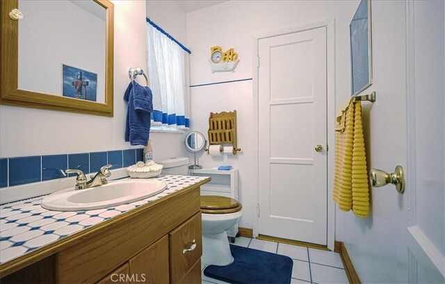 5062 Magnolia Ave, Riverside, CA 92506 - bathroom featuring toilet, vanity, and tile patterned floors