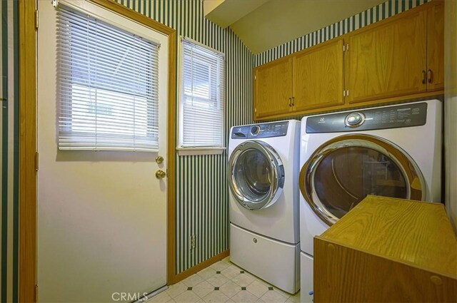5062 Magnolia Ave, Riverside, CA 92506 - laundry room with independent washer and dryer, cabinet space, and baseboards