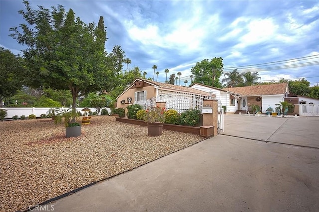 5062 Magnolia Ave, Riverside, CA 92506 - view of front of property with stucco siding and a gate