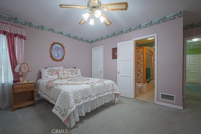 5062 Magnolia Ave, Riverside, CA 92506 - carpeted bedroom with ensuite bathroom, baseboards, and ceiling fan