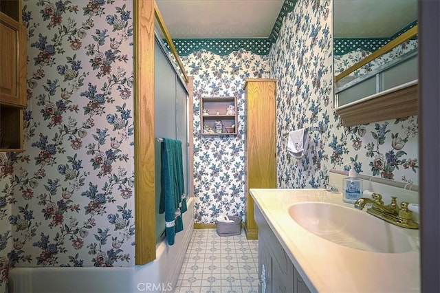 5062 Magnolia Ave, Riverside, CA 92506 - bathroom with wallpapered walls, vanity, tub / shower combination, baseboards, and tile patterned floors