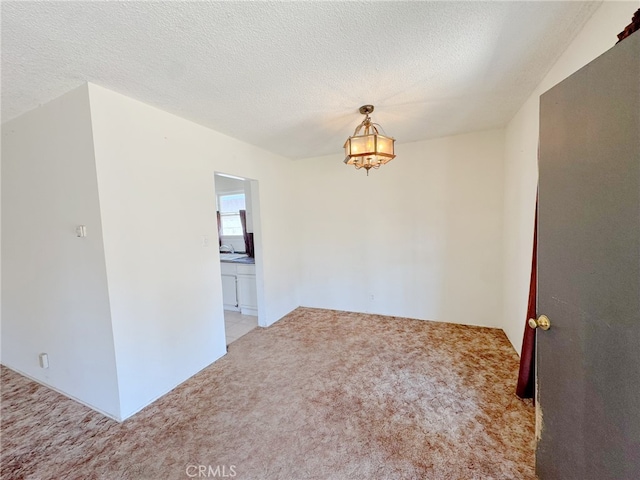 2574 W Glencrest Ave, Anaheim, CA 92801 - unfurnished room with carpet, a chandelier, and a textured ceiling