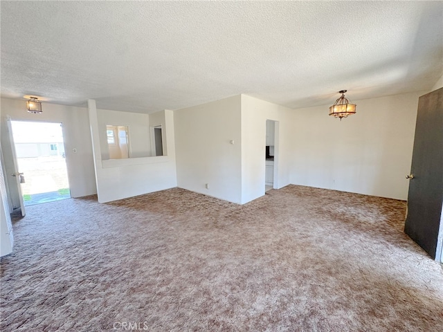 2574 W Glencrest Ave, Anaheim, CA 92801 - empty room featuring a textured ceiling and carpet flooring