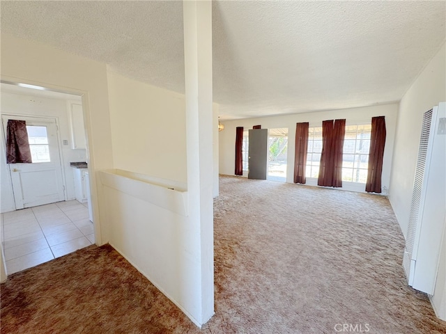 2574 W Glencrest Ave, Anaheim, CA 92801 - hall featuring carpet floors, a heating unit, and a textured ceiling