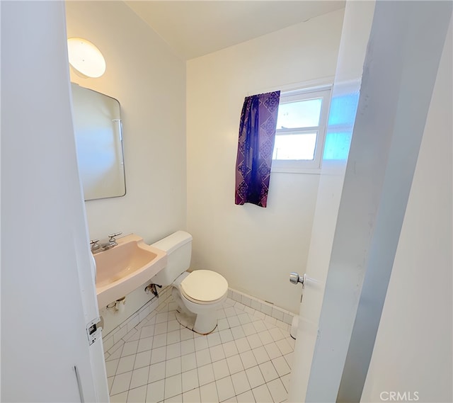 2574 W Glencrest Ave, Anaheim, CA 92801 - half bathroom featuring a sink and tile patterned floors