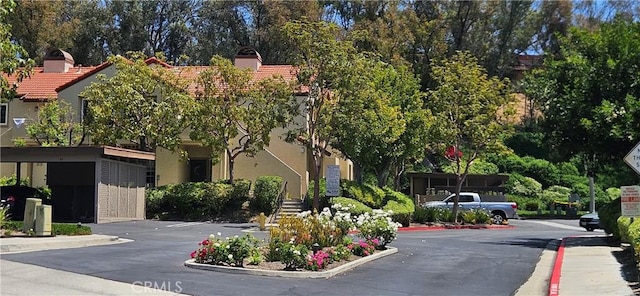 21208 Camelia Unit 44, Lake Forest, CA 92630 - view of asphalt road with curbs and sidewalks