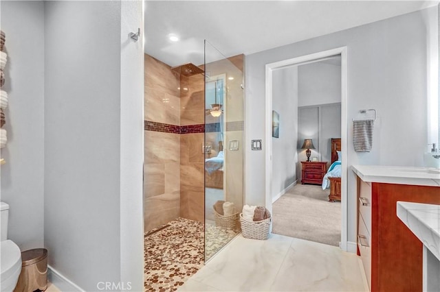 631 Holmes Ave, Placentia, CA 92870 - bathroom featuring ensuite bathroom, walk in shower, toilet, vanity, and baseboards