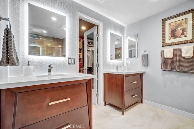 631 Holmes Ave, Placentia, CA 92870 - full bathroom featuring two vanities, a shower stall, a spacious closet, and baseboards
